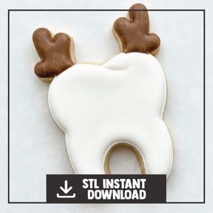 May include: A cookie in the shape of a tooth with brown antlers. The tooth is white with a tan outline, and the antlers are brown. The image also includes the text "STL INSTANT DOWNLOAD" in a black rectangle.