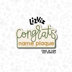 May include: A beige and green "Congrats" name plaque with the text "LizViz" and "Font: kg red hands". The text "Stencil or Stamp Sold Separately" is below the plaque.