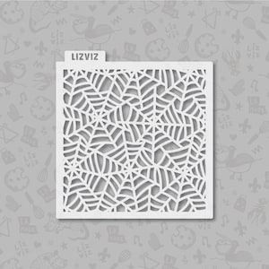 May include: A white plastic stencil with a spiderweb design. The stencil is square and has a cutout design of a spiderweb.