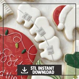 Puede incluir: Surtido de galletas de azúcar decoradas. Se presentan galletas blancas con forma de dientes con aparatos ortopédicos. Otras galletas incluyen un gorro de Papá Noel, luces navideñas y una galleta roja con texto. La imagen incluye el texto "STL INSTANT DOWNLOAD".