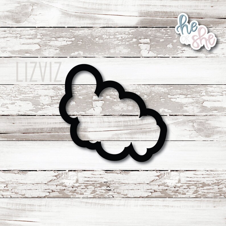 May include: Black metal cookie cutter shaped like a cloud.