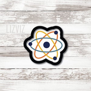 May include: A white atom with a black outline and three rings in orange, yellow, and blue. The atom has a dark blue center.