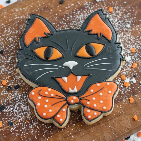retro vintage halloween cookie cutter screaming cat with bow