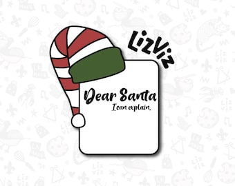 May include: A white card with the text "Dear Santa I can explain" written in black. A red and white striped Santa hat with a green brim is peeking out from behind the card. The text "LizViz" is written in black above the card.