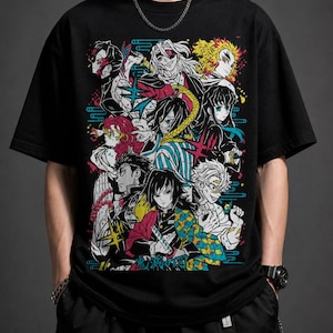 May include: Black t-shirt featuring a colorful graphic of anime characters. The design includes various figures with detailed facial features and vibrant hair, set against a backdrop of teal and pink accents. The shirt is a casual wear item.