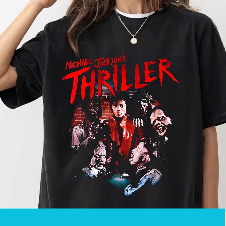 May include: Black t-shirt with the words "Michael Jackson's Thriller" in red, and a graphic of Michael Jackson surrounded by zombies. The design is a vintage-style print.