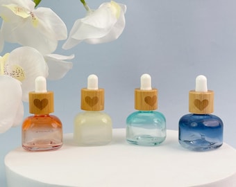 Frasco conta-gotas de vidro colorido de 10ml, mini frasco de soro recarregável com tampa de bambu em formato de coração, frasco vazio para óleo essencial, frasco para tintura.