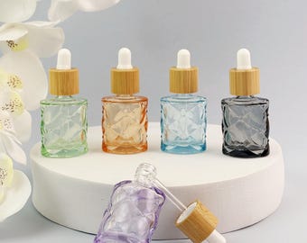 Frasco conta-gotas de vidro colorido de 10ml, frasco quadrado acolchoado para soro com tampa de bambu, frasco vazio para óleo essencial, frasco recarregável para tintura.