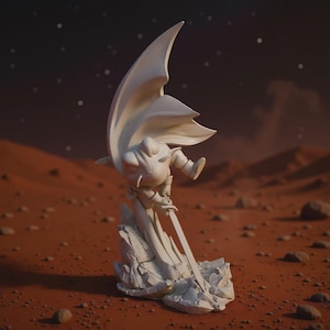 May include: A white figurine of a superhero with a flowing cape, poised with a sword. The sculpture is set on a reddish-brown, rocky terrain, with a starry night sky in the background. The figure is detailed and appears to be made of a solid material.