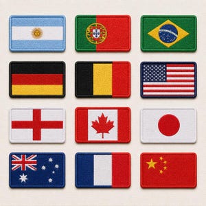 May include: A collection of twelve rectangular embroidered patches featuring various national flags, including Argentina, Portugal, Brazil, Germany, Belgium, the United States, England, Canada, Japan, Australia, France, and China, arranged in a grid.