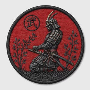 May include: A circular embroidered patch featuring a kneeling samurai in dark gray armor on a vibrant red background. The samurai holds a katana across their lap. Two leafy branches flank the figure, and the Japanese kanji character for martial is visible.