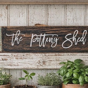 May include: A distressed wooden sign with the words "Welcome to our home" in white. The sign has a rustic finish, ideal for adding a welcoming touch to any home's entrance.