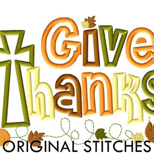 May include: Embroidered design with the words "Give Thanks" in a multi-colored font with a cross and fall leaves. The text "ORIGINAL STITCHES" is at the bottom of the design.