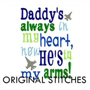 May include: Embroidered design with the text "Daddy's always in my heart, now He's in my arms!" with two small airplane graphics. The text is in various colors, including blue, green, and yellow. The text "ORIGINAL STITCHES" is at the bottom of the design.