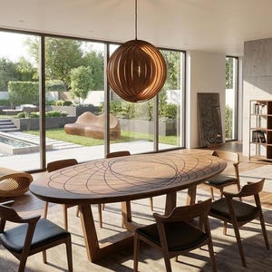 May include: A contemporary dining room featuring an oval wooden table and chairs. A globe-shaped wooden light fitting hangs above. A wooden lounger and a world map artwork are also visible. The table is approximately 300cm long.