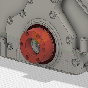 May include: A detailed 3D rendering of an engine component. The image showcases a gray metal housing with a prominent red circular flange featuring multiple bolt holes. The design suggests a mechanical or automotive part.