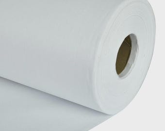 May include: A roll of white paper, tightly wound, with a visible cardboard core. The paper appears smooth and opaque, suggesting a high-quality material. The roll is partially unraveled, revealing the paper's texture and thickness.