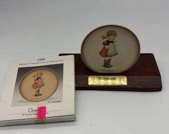 Goebel Hummel miniature collector plate titled "A Stitch in Time" Wood Holder