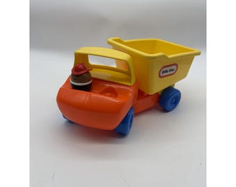 Camión volquete de juguete de construcción Little Tikes Toddle Tots con figuras giratorias