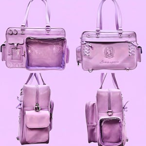 May include: A lilac handbag with multiple compartments, including a clear front pocket. The bag features top handles, decorative stitching, and side pockets. The bag has the text "Love is supreme" on the front.