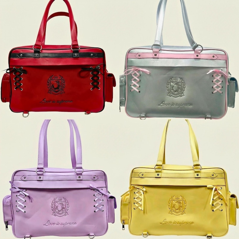 May include: Four colourful tote bags in red, grey, lavender, and yellow. Each bag features a rectangular shape, top handles, side pockets, and decorative lacing. The bags have a crest emblem and the text "Love is supreme".