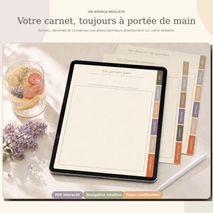 May include: A digital tablet displaying a planner interface with tabbed sections labeled in French, including Les petites joies. The screen shows a blank rectangular writing area. A white stylus rests beside the tablet on a light surface.