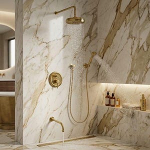 May include: A luxurious gold-toned shower fixture set against a marble wall. The set includes a rain shower head, handheld shower, and faucet. Water streams from the shower heads. The marble wall has brown and gold veining.