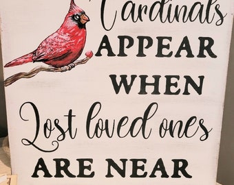 CARDINALS appear when lost loved ones are near wood wall hanging