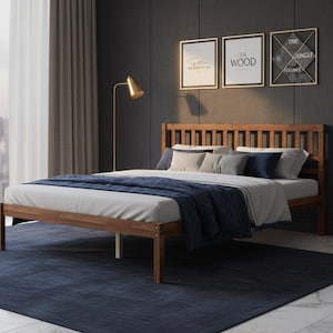 May include: A wooden bed frame with a slatted headboard, featuring a white mattress, a navy blue throw blanket, and several pillows in shades of white, gray, and navy blue. The bed is positioned in a room with dark walls and three framed wall art pieces.