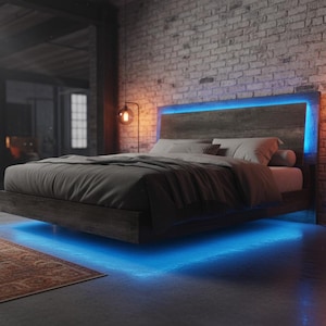 May include: A modern bed frame with a gray headboard and blue LED lighting. The bed is made up with gray bedding and pillows. The room has a brick wall and a rug on the floor. Two lamps with round bulbs are on either side of the bed.