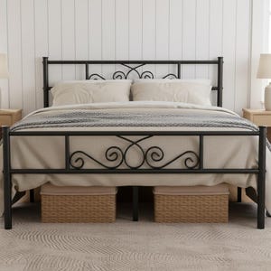 May include: A black metal bed frame with decorative scrollwork on the headboard and footboard. The bed is made up with neutral-colored bedding and has two matching nightstands with lamps on either side. Two woven baskets are under the bed.