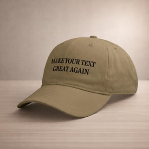 May include: A khaki-colored baseball cap with the text "MAKE YOUR TEXT GREAT AGAIN" in black. The cap has a curved brim and a rounded crown, suitable for casual wear.