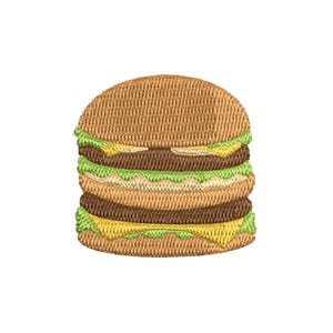 Può includere: Immagine ricamata di un hamburger impilato con due polpette, lattuga e formaggio. I panini superiore e inferiore sono di colore marrone chiaro e l'hamburger è su sfondo bianco.
