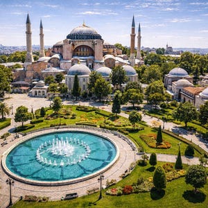 Può includere: Vista aerea di Santa Sofia a Istanbul, Turchia, con una grande cupola centrale, minareti ed edifici circostanti. Una grande fontana è in primo piano, circondata da prati verdi e alberi sotto un cielo blu.