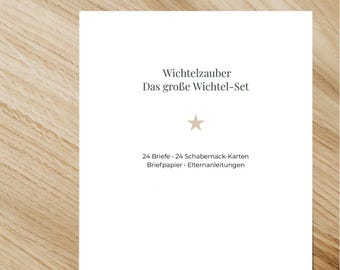 May include: A white card with the text "Wichtelzauber Das große Wichtel-Set" in green. The card also includes the text "24 Briefe - 24 Schabernack-Karten Briefpapier - Elternanleitungen". The card is on a wooden surface.