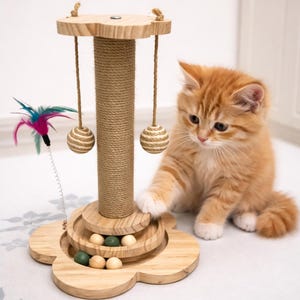 May include: A wooden cat scratching post with a flower-shaped base, a central sisal-wrapped post, and hanging toys. An orange kitten with white paws is interacting with the toy. The post includes small wooden and green balls.