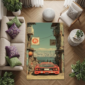 May include: A rectangular area rug featuring a vibrant illustration of a red sports car parked on a street with Japanese signage. The rug showcases a cityscape backdrop with a blue sky and ocean view. The rug is surrounded by furniture.