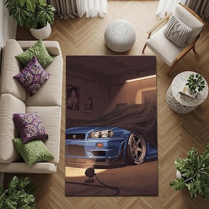 May include: A blue sports car rug with a black cover in a garage setting. The rug features a detailed illustration of a car with visible headlights and tyres. The background includes garage elements and artwork.