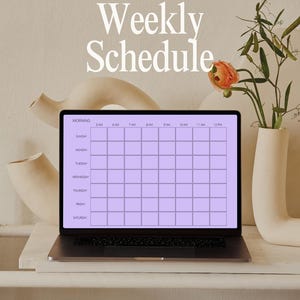 May include: A laptop displaying a weekly schedule template in a soft purple grid. The words "Weekly Schedule" are at the top. The laptop sits on a white shelf, with decorative vases and a flower arrangement in the background.