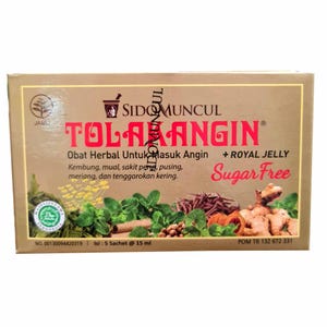 May include: A tan rectangular box of Tolak Angin herbal medicine. The box has red and white text, including "Tolak Angin", "Sugar Free", and "Royal Jelly". The box also features images of herbs and spices.
