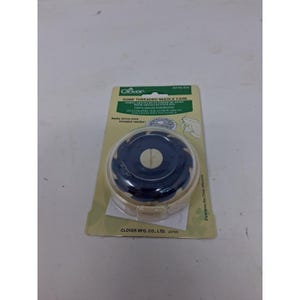 May include: A Clover Dome Threaded Needle Case in a circular, dark blue plastic design with a clear cover, mounted on a rectangular cardboard backing. The packaging features green and white text, including the product name and Clover Mfg. Co., Ltd. Japan.