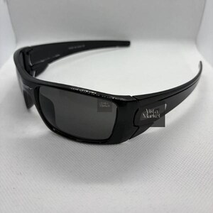 May include: A set of three ceramic mugs with a speckled, matte finish. The mugs are in shades of cream, light gray, and dark gray. Each mug has a simple, minimalist design and a rounded handle. The mugs are stacked on top of each other.