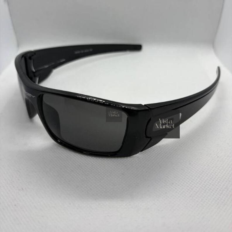 May include: A set of three ceramic mugs with a speckled, matte finish. The mugs are in shades of cream, light gray, and dark gray. Each mug has a simple, minimalist design and a rounded handle. The mugs are stacked on top of each other.