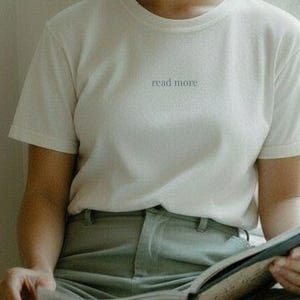 read more | minimalist tiny text t-shirt | vintage white | blue-grey lettering | reader shirt | Tender Form Apparel