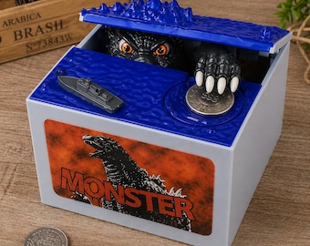 Hucha interactiva de Godzilla, caja de dinero automática con efectos de sonido y luz, juguete de ahorro para niños.