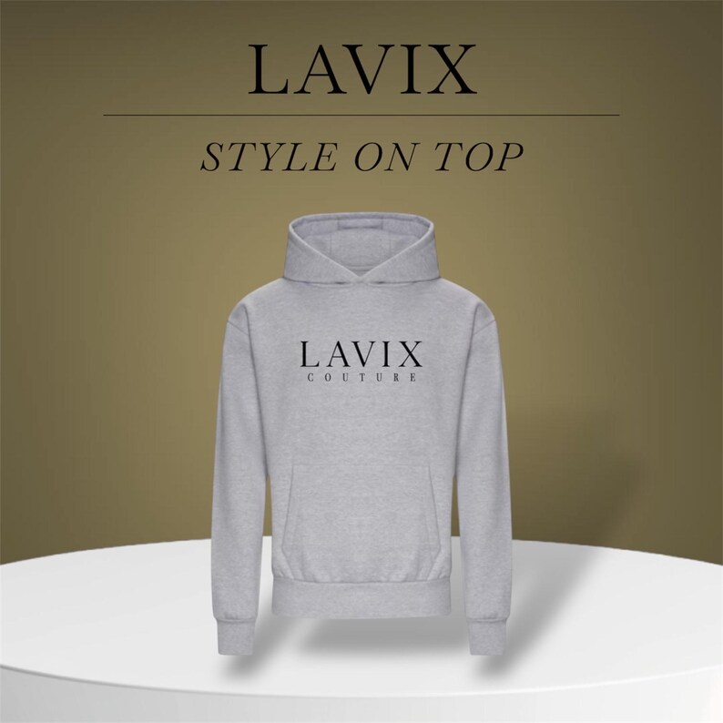 May include: A light gray hoodie with the text "LAVIX COUTURE" in black. The hoodie has a front pocket and a hood. The words "LAVIX" and "STYLE ON TOP" are also displayed in black. The hoodie is displayed on a white surface.