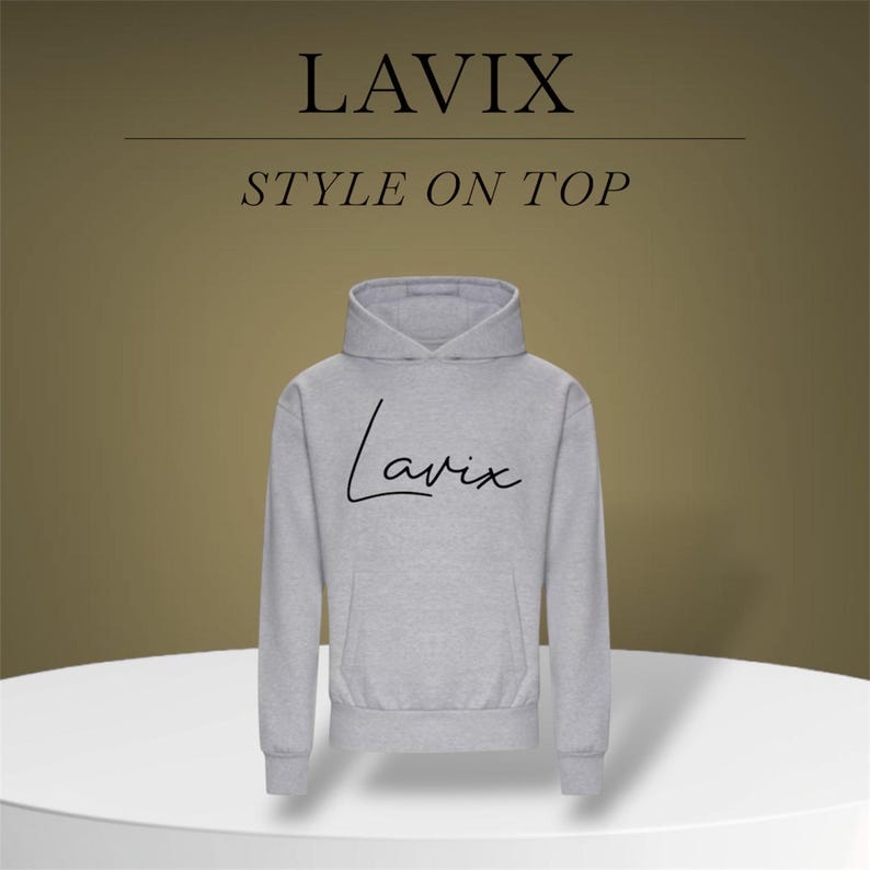 May include: A light gray hoodie with the word "LAVIX" above "STYLE ON TOP" in black text. The word "Lavix" is also written in cursive on the front of the hoodie. The hoodie is displayed on a white surface.