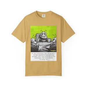 May include: Mustard yellow t-shirt featuring a cartoon illustration of an insect named Ben in an office setting. The image includes text that reads, "At the interview, Ben is asked if he can handle a buzz-worthy project. He's not sure about the workload, but he's ready to wing it!"