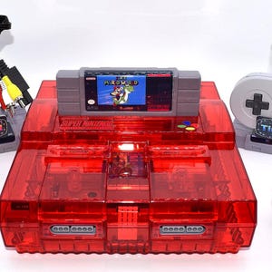 SNES Super Nintendo Console with Red Translucent Shell + HDMI Adapter + 2nd Controller + Super Mario World (Blame the Cat) Bundle