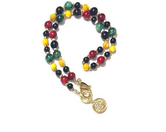 Rastakleurige kralenketting met leeuwenbedel "Lion of Sion"